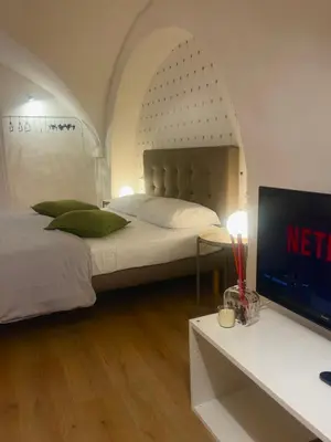 Letto o letti in una camera di VagaLuna Short Stay
