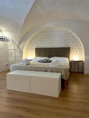 Letto o letti in una camera di VagaLuna Short Stay