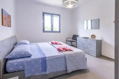 Letto o letti in una camera di White House Villa Luisa