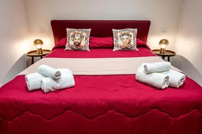 Letto o letti in una camera di Palazzo Bicocca Rooms