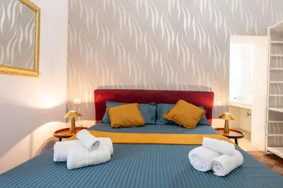 Letto o letti in una camera di Palazzo Bicocca Rooms