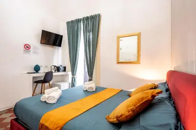 Letto o letti in una camera di Palazzo Bicocca Rooms