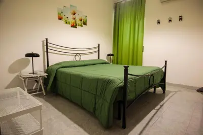 Letto o letti in una camera di Casa Agorà