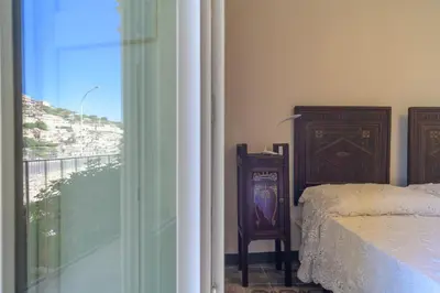 Letto o letti in una camera di Appartamenti Vista San Giorgio - Pomelia