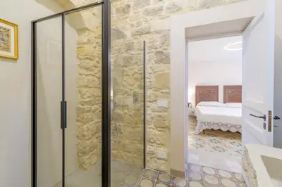 Letto o letti in una camera di Appartamenti Vista San Giorgio - Pomelia