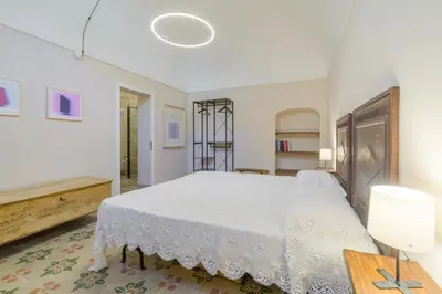 Letto o letti in una camera di Appartamenti Vista San Giorgio - Pomelia