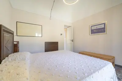 Letto o letti in una camera di Appartamenti Vista San Giorgio - Pomelia