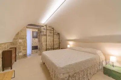 Letto o letti in una camera di Appartamenti Vista San Giorgio - Pomelia