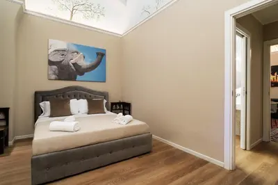 Letto o letti in una camera di Archimedes suites
