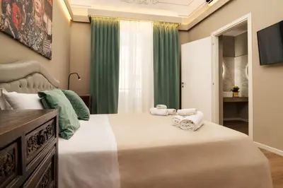 Letto o letti in una camera di Archimedes suites