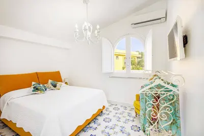 Letto o letti in una camera di Villa Blu Marino by Villa Plus