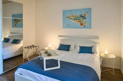 Letto o letti in una camera di Melpomene e Talìa Casa Vacanze a Siracusa