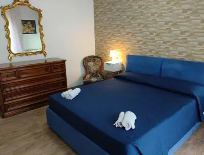 Letto o letti in una camera di Bombana Beach - Vicino