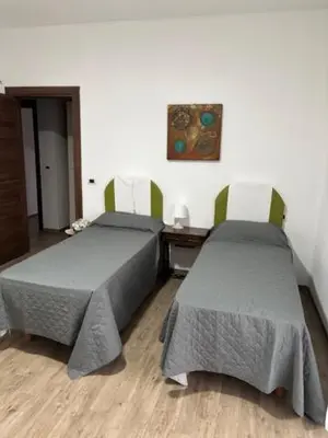 Letto o letti in una camera di Bombana Beach - Vicino