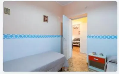 Letto o letti in una camera di Villa Adele