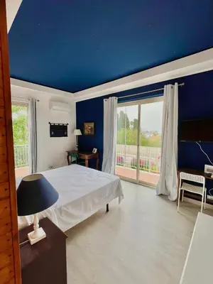 Letto o letti in una camera di B&B Villa Dunardi
