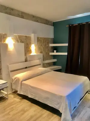 Letto o letti in una camera di B&B Villa Dunardi