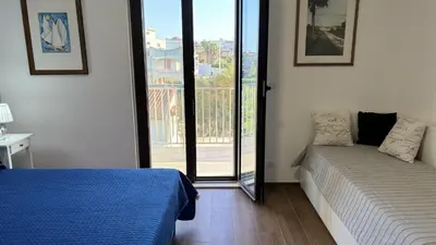 Letto o letti in una camera di Villa sapore di mare 30 passi dalla spiaggia