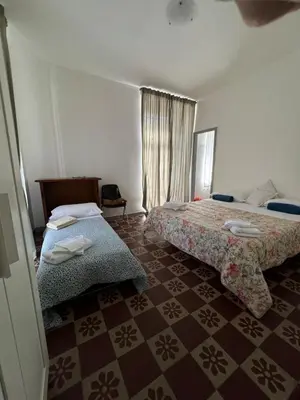 Letto o letti in una camera di Chez Elle - Casa Vacanze due Camere Catania Centro