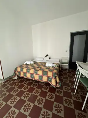 Letto o letti in una camera di Chez Elle - Casa Vacanze due Camere Catania Centro