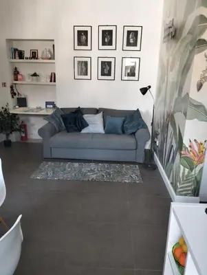 Area soggiorno di Hora Guest House by Ortigia Apartments