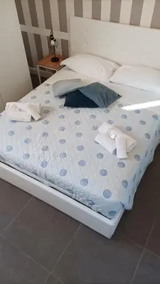 Letto o letti in una camera di Hora Guest House by Ortigia Apartments