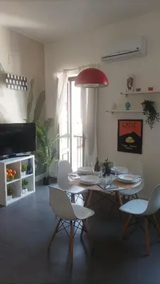 TV o dispositivi per l'intrattenimento presso Hora Guest House by Ortigia Apartments