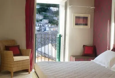 Letto o letti in una camera di Le Lumie