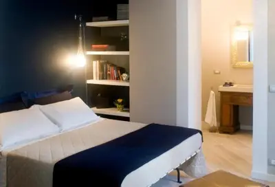 Letto o letti in una camera di Le Lumie