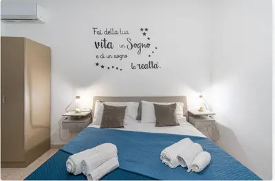 Letto o letti in una camera di villa Gardenia fronte mare x6 apartaments