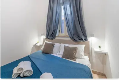 Letto o letti in una camera di villa Gardenia fronte mare x6 apartaments