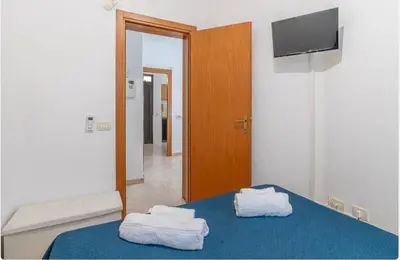 Letto o letti in una camera di villa Gardenia fronte mare x6 apartaments