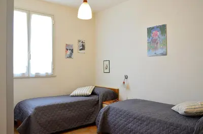 Letto o letti in una camera di Villa Sole con accesso diretto alla spiaggia