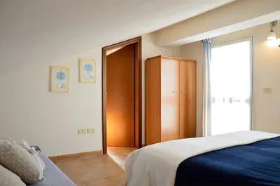Letto o letti in una camera di Villa Sole con accesso diretto alla spiaggia