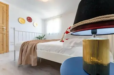 Letto o letti in una camera di Villa Belvedere di Capopassero a Marzamemi