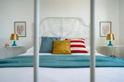 Letto o letti in una camera di Villa Belvedere di Capopassero a Marzamemi