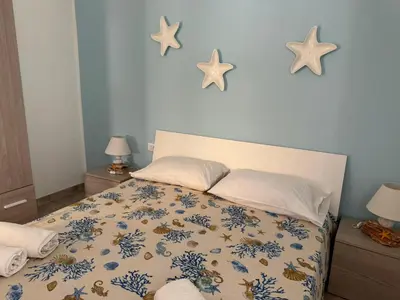 Letto o letti in una camera di Perla