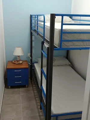 Letto o letti in una camera di Perla
