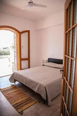 Letto o letti in una camera di Villa Carmela 1