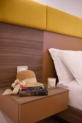 Letto o letti in una camera di San Nicola Rooms Siracusa