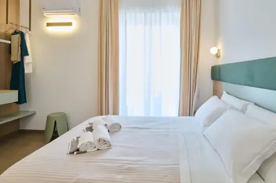 Letto o letti in una camera di San Nicola Rooms Siracusa