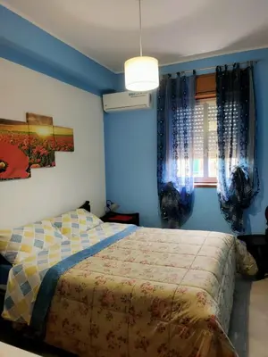 Letto o letti in una camera di Villa Guido
