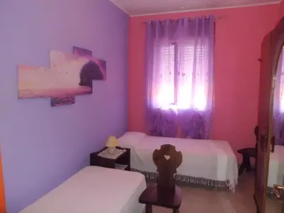 Letto o letti in una camera di Villa Guido