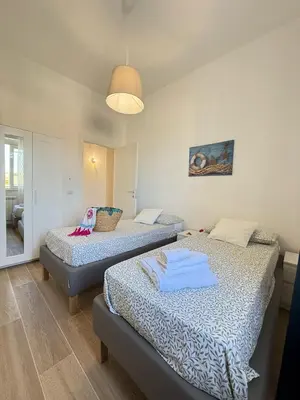 Letto o letti in una camera di Villa Acquamarina
