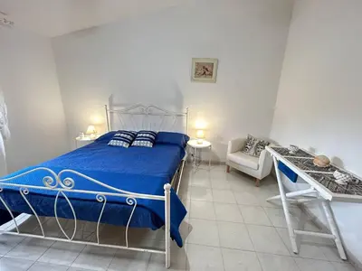 Letto o letti in una camera di Villa Malsine