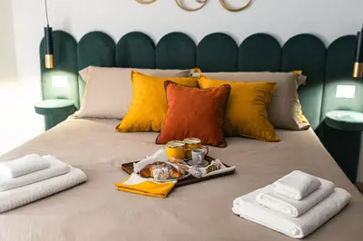 Letto o letti in una camera di Mirò Suite Catania - Elegant Apartment Centro Storico