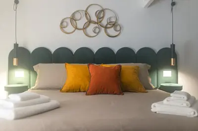 Letto o letti in una camera di Mirò Suite Catania - Elegant Apartment Centro Storico
