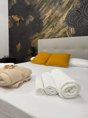 Letto o letti in una camera di Antica Sicilia Rooms and Breakfast