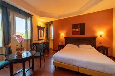 Letto o letti in una camera di Hotel Teocrito