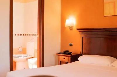 Letto o letti in una camera di Hotel Teocrito